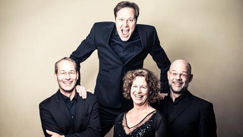 Vier Msusiker ohne Instrument lachen - Mandelringquartett